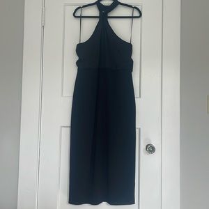 Black halter midi length dress that accentuates your natural curves